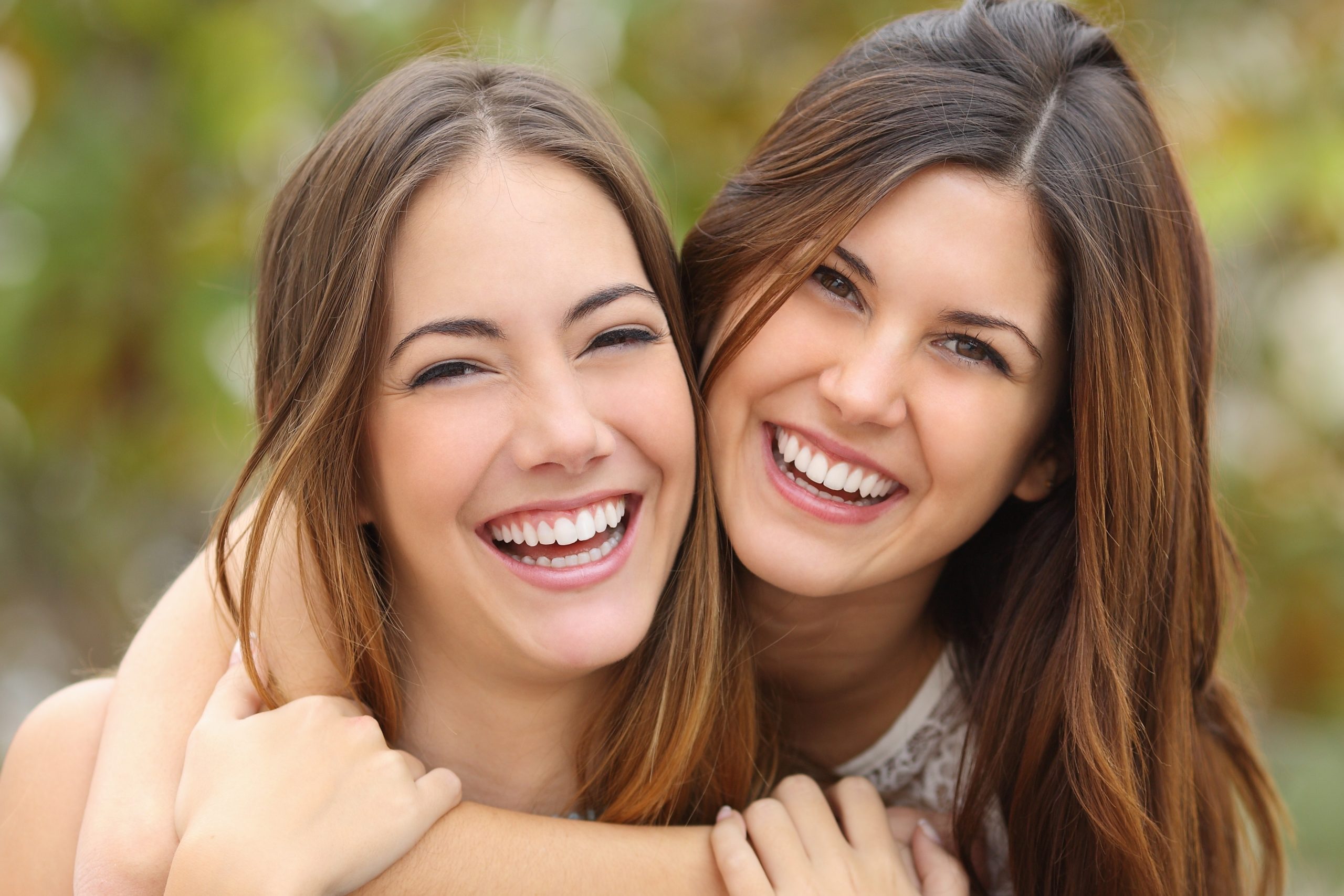 two women smiling, cosmetic dentistry, cosmetic treatments